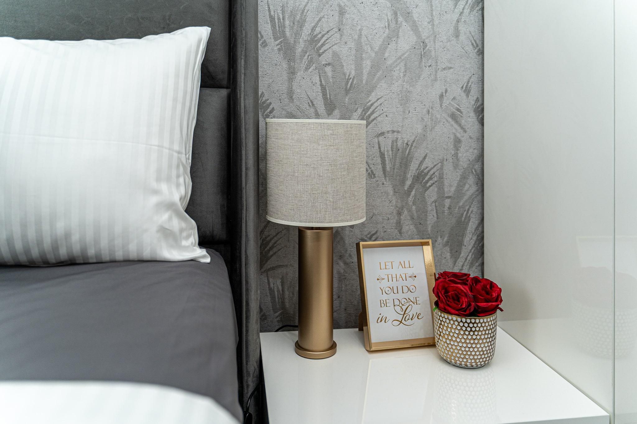 Bedside table in a furnished bedroom