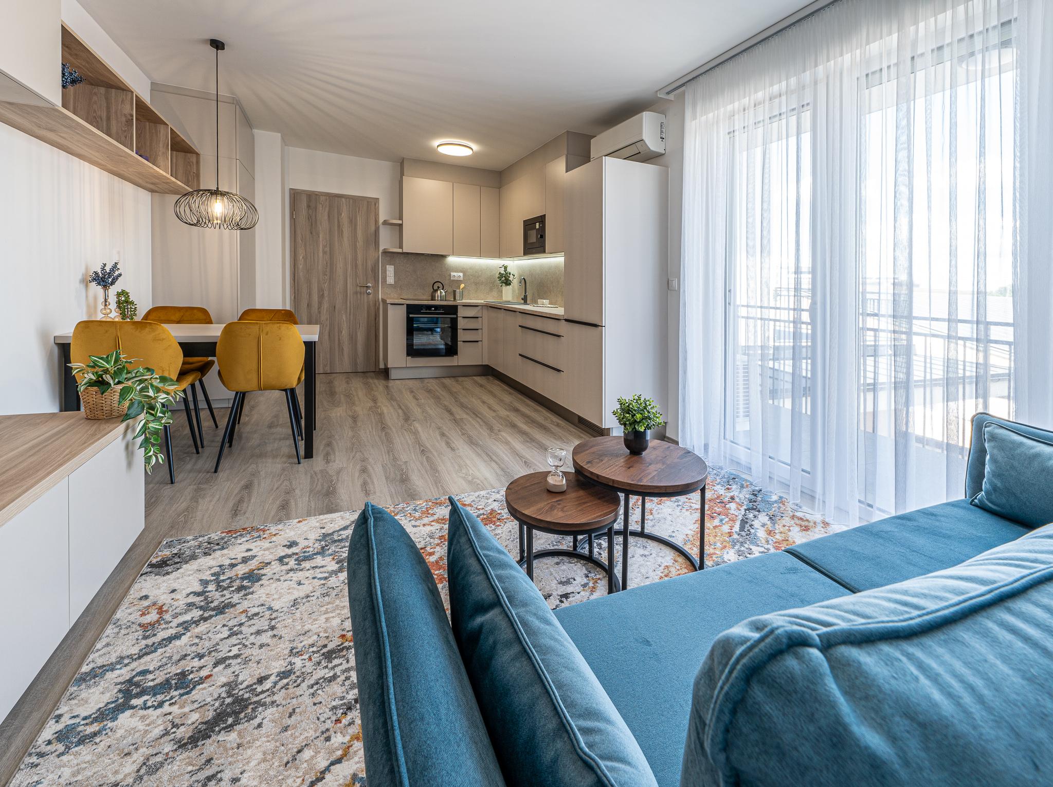 Photo of a furnished living room and kitchen