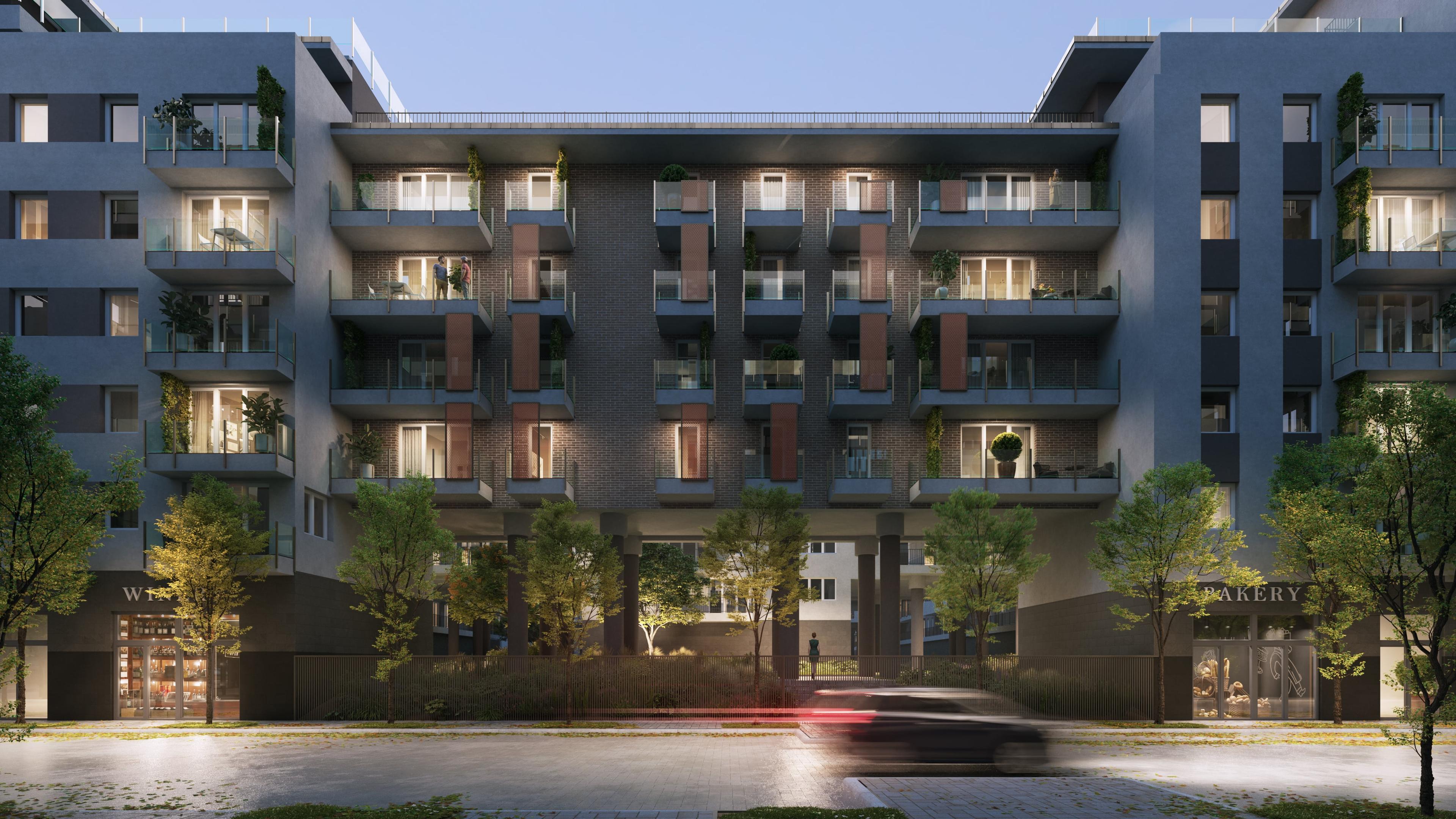 A Park West lakóprojekt homlokzata sötétedés után